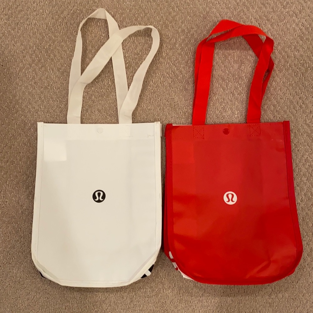 Two small white and red Lululemon reusable bags
